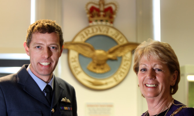 Wing Commander Jez Holmes of No.2 Squadron and Provost Helen Oswald mark the centenary of the air base.