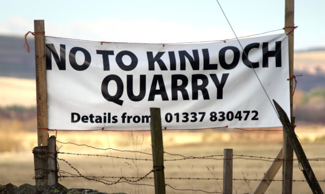 Kris Miller, Courier, 25/02/13. Picture today at the proposed site of a new quarry shows a protestors banner.