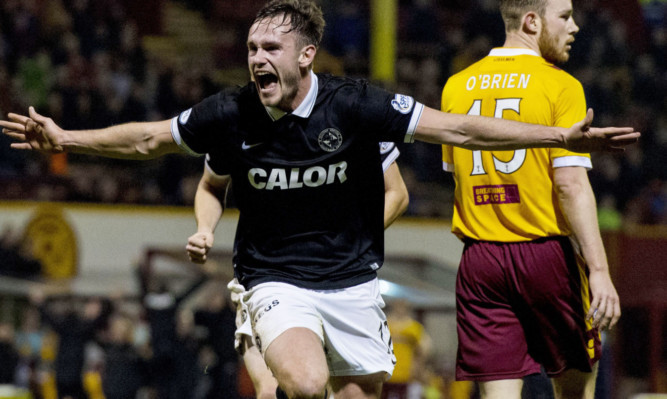 Keith Watson wheels away to celebrate his winning goal.