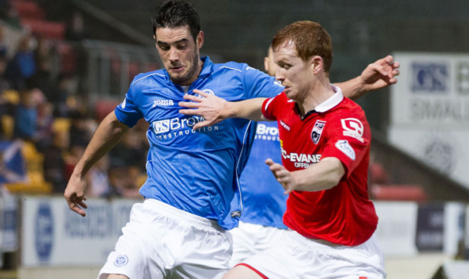 Brian Graham tries to get past Scott Boyd on Saturday.