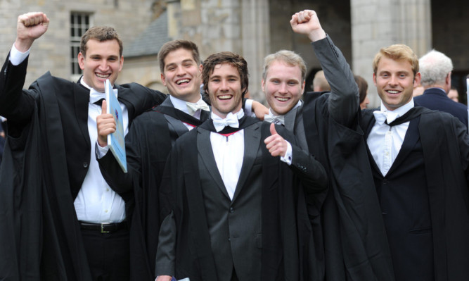 From left: Eric Andrews, Max Goodman, James Owens, Henry Hayes and Cole Sedgwick celebrate in St Salvators Quadrangle after their graduation ceremony last year.