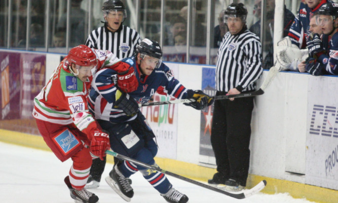 Dundee Stars Igor Gongalsky and Cardiff Devils Luke Piggott tussle during the clash in Dundee  another defeat for the Tayside team.