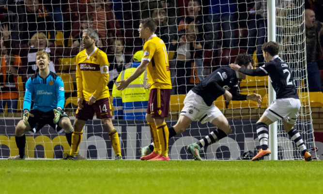 John Souttar (2nd right) charges off to celebrate his equaliser.