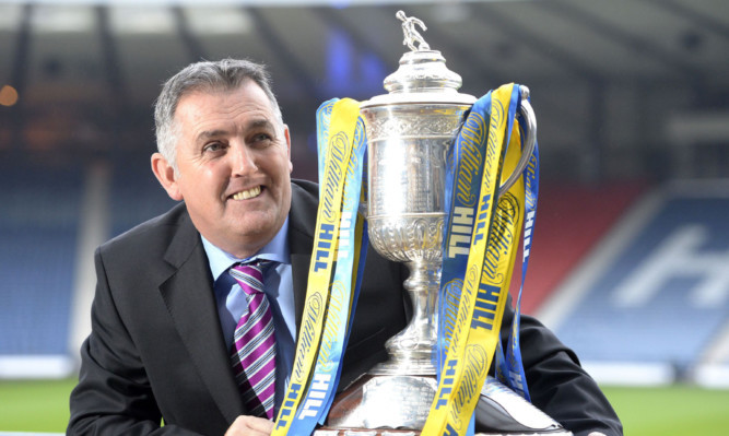 Owen Coyle is all smiles as he helps conduct the draw for the fifth round of the William Hill Scottish Cup.
