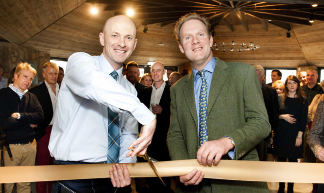 Founder Douglas Clement cuts the ribbon with distillery director William Wemyss.