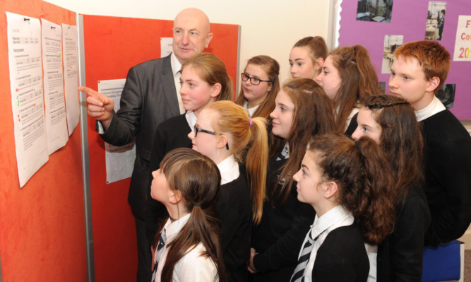 Viewforth High School pupils are shown some of the budget proposals by Neil Crooks, Kirkcaldy area committee chairman, and invited to discuss them.