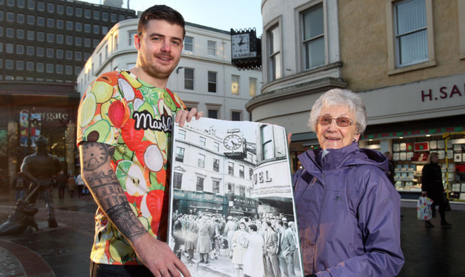 Jamie Shankland and Ellen Kerr with the half-century-old photo she was captured in and which is now tattooed on Mr Shanklands right arm.