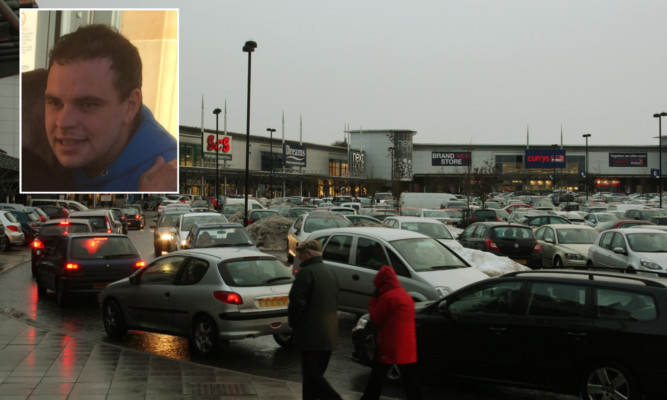 Steven Jamie McDonald (inset) took two children along with him as he targeted stores in the Kingsway West Retail Park.