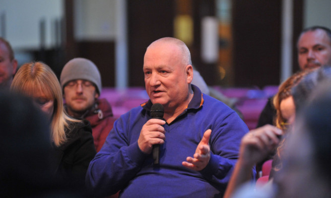 Members of the public speak out on the subject of fracking at a meeting in Glenrothes.