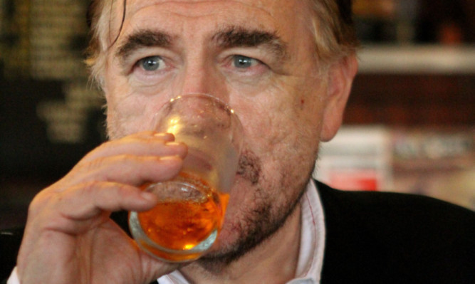 Dundee-born actor Brian Cox enjoying an Irn-Bru during the Scottish referendum campaign in the city.