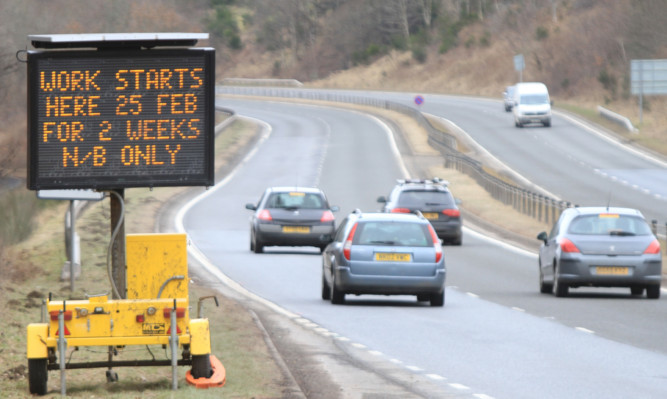 Kris Miller, Courier, 22/02/13. Picture today on the A9 north of Ballinluig shows a roadsign warning of upcoming roadworks.