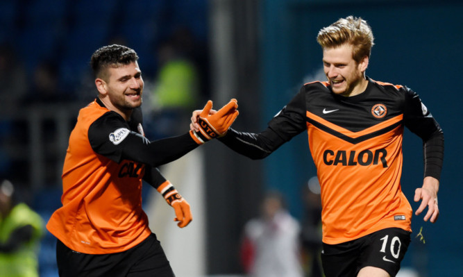 Stuart Armstong (right) celebrates with fellow goalscorer Nadir Ciftci after doubling Dundee Utd's lead.