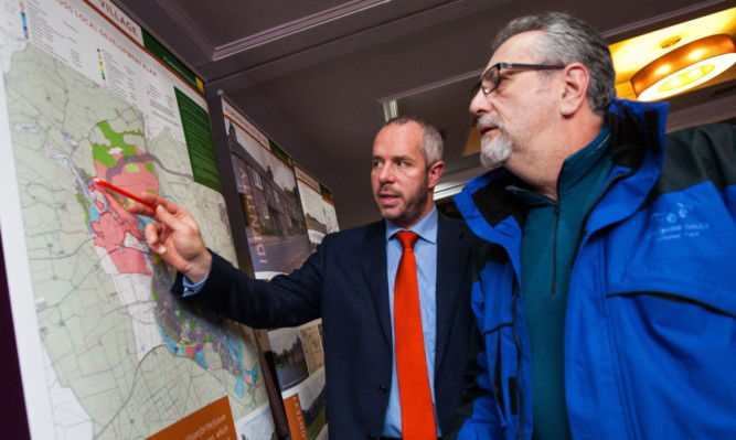 Ewan McIntyre, left, from EMA Architecture, outlines the Almond Valley plans to resident John Lilburn.