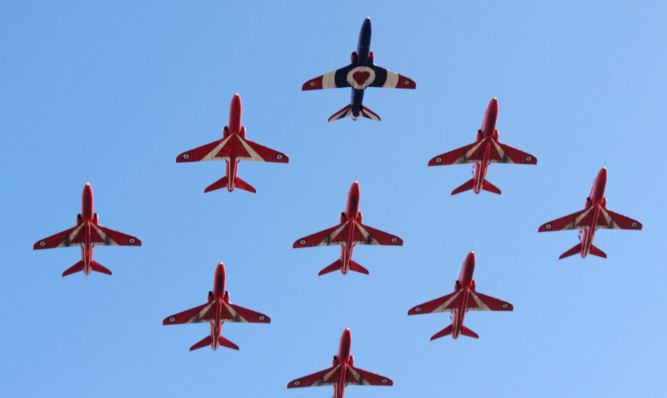 The Red Arrows team returning to RAF Cranwell after performing the first 9-ship since the end of the 2011 season.