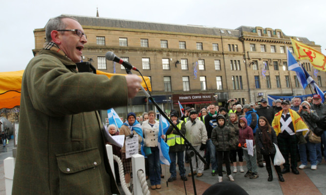 Deputy Leader of the SNP Stewart Hosie addresses the anti-austerity rally in the City Square.