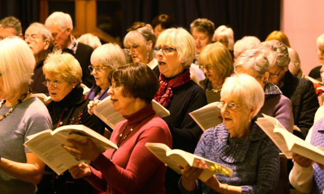 Members of the Health Services Choir rehearsing at the Trinity Hall in Dundee.