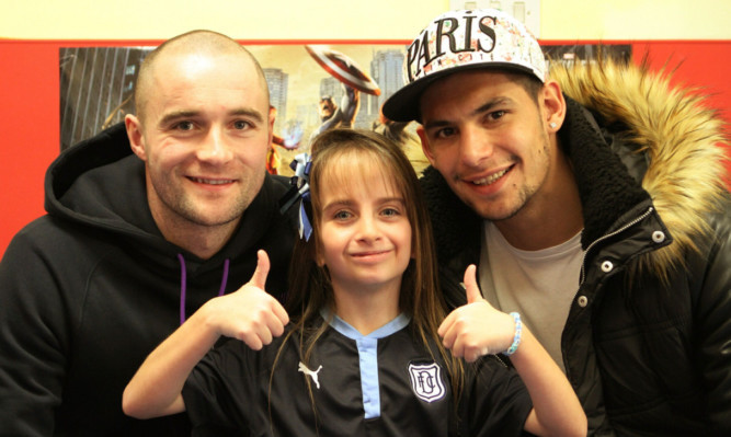 Bryony Duthie poses with players James McPake and Luka Tankulic.