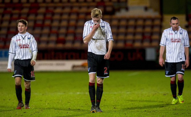 Dejection for Dunfermline's Josh Falkingham, Ross Millen and Michael Moffat as their side crashes out of the Scottish Cup