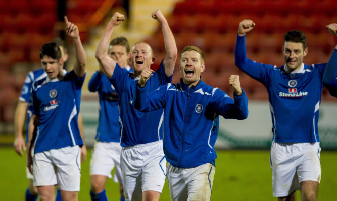 Stranraer celebrate at full time having beaten Dunfermline to progress to the next round of the cup