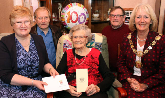 Ann Mackintosh flanked by her children, from left, Margaret, Ronald and Douglas and Angus Provost Helen Oswald, right.