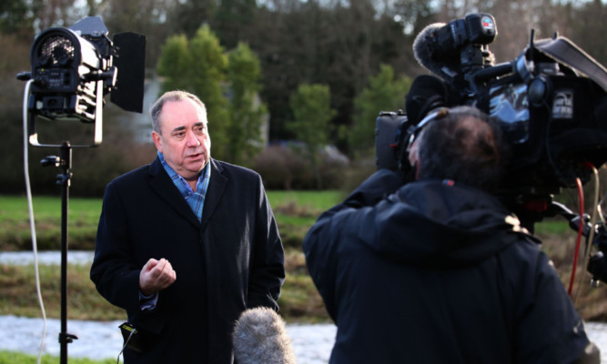 Alex Salmond is interviewed for TV after announcing he will stand as a candidate for Westminster.