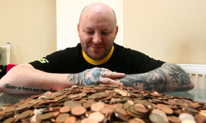 John Leech with his pile of pennies.