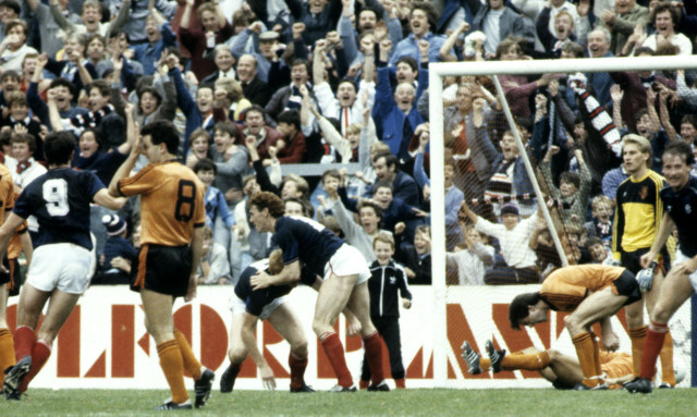 Dundee players rush to congratulate 
John Brown (centre, obscured) after his winning goal in a 4-3 thriller at Tannadice on September 8 1984.