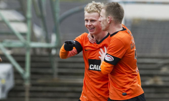 Gary Mackay-Steven celebrates his goal with team-mate Michael Gardyne.