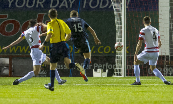 Dundee's Greg Stewart pulls back a goal for Dundee.