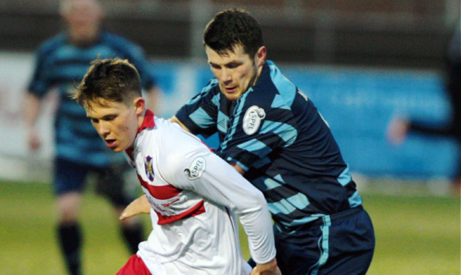 Forfars Dale Hilson tries to win the ball from Alex Beith.