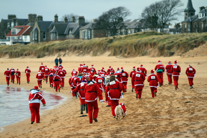 Dozens of hardy souls donned their festive gear and braved the wintry weather on Fifes coast for the Ellie Santa Fun Run.