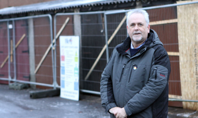 Bill Brown beside lockup garages in Sinclair Avenue.