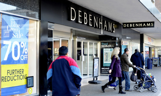 Investors were chilled by a profits warning by Debenhams, which said January's heavy snow had disrupted its operations