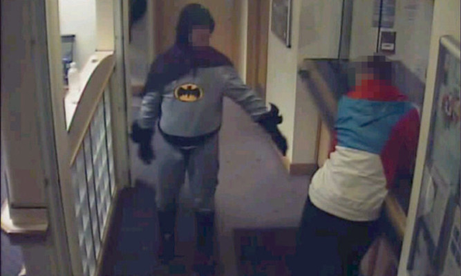 Stan Worby handed over the alleged criminal to police in Bradford while dressed as Batman.