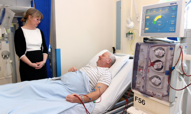 Health Secretary Shona Robison chats with patient Robert Gillbert, 63, from Kirriemuir.