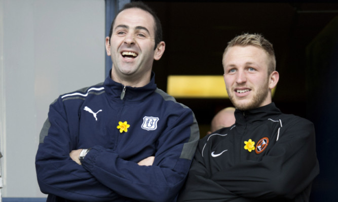 Johnny Russell and Gary Harkins (left) watching Sunday's derby from the sidelines.