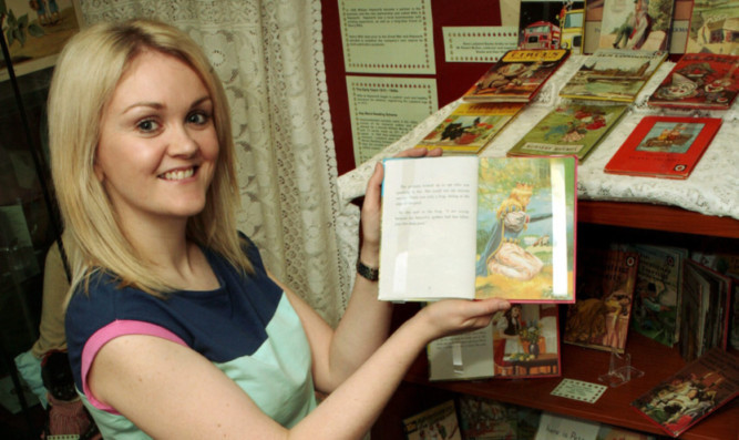 Glens Museum assistant Ruth Nelson with her own personal favourite The Princess and the Frog.