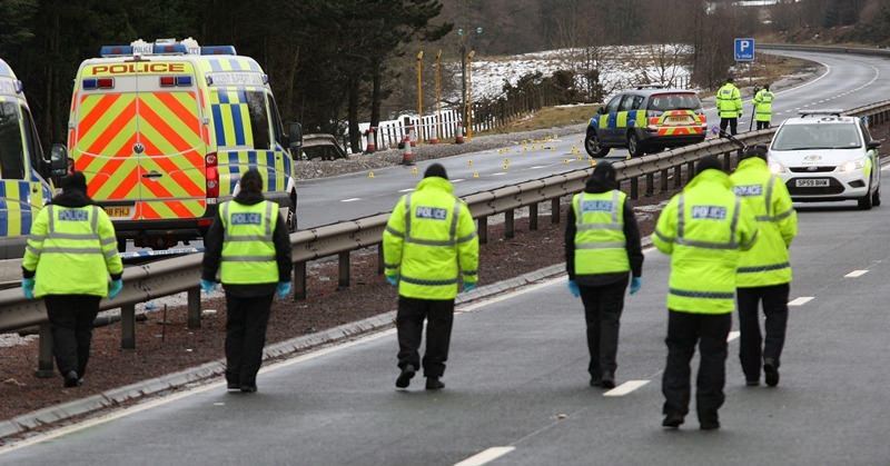 Kris Miller, Courier, News, 05/01/11. Picture today at A9 by Auchterarder. Pic shows police investigating the scene of fatality on the South bound carraigeway as officers conduct a search of the north bound carraigeway.