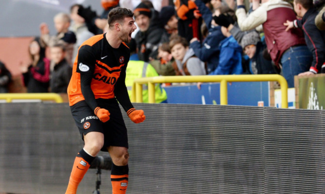 Nadir Ciftci celebrates in front of the United fans.