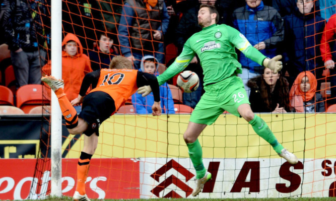 Stuart Armstong heads the ball past Celtic keeper Craig Gordon.