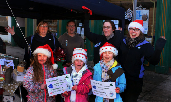 Members of the Montrose and District Brownies at their stall.