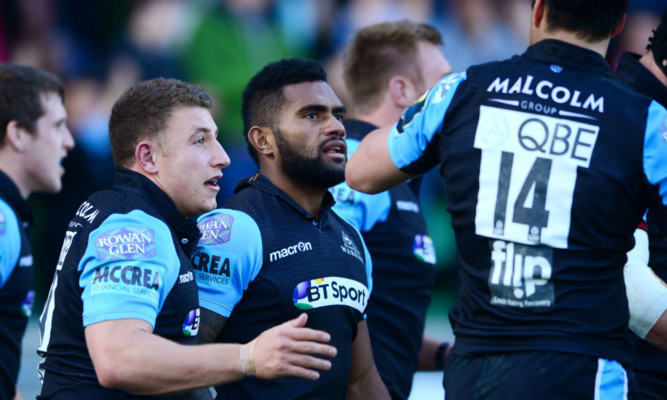 Niko Matawalu celebrates another try with Glasgow team mates.