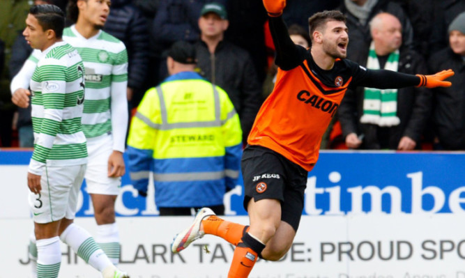 Nadir Ciftci wheels away after netting against Celtic.