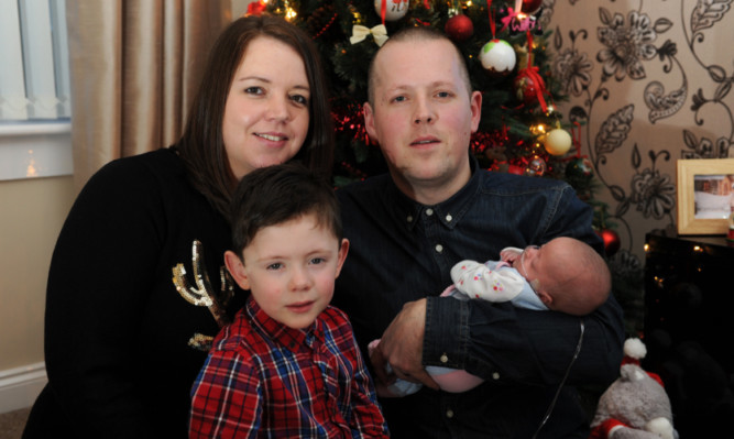 Kerry and Adam Larmour with their children Joel and Willow.