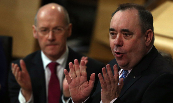 John Swinney and Alex Salmond in the Scottish Parliament.
