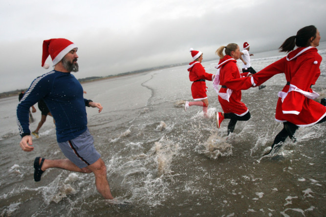Santa and his doubles were at Levenmouth promenade to raise funds for CLIC Sargent in a Boxing Day 'Dip Wi' a Nip'. Around 40 hardy souls dressed up and braved the chill for the annual dook, while huge crowds gathered to cheer them on.