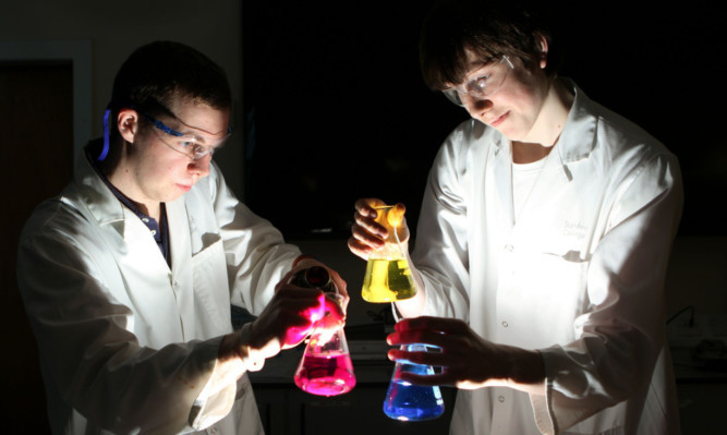 Dundee & Angus College HND biomedical science students Liam Hayman, left, and Matthew Smith creating some concoctions for this years Dundee Science Festival.