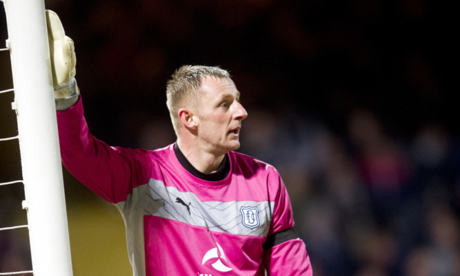 Rab Douglas in action for Dundee against St Mirren.