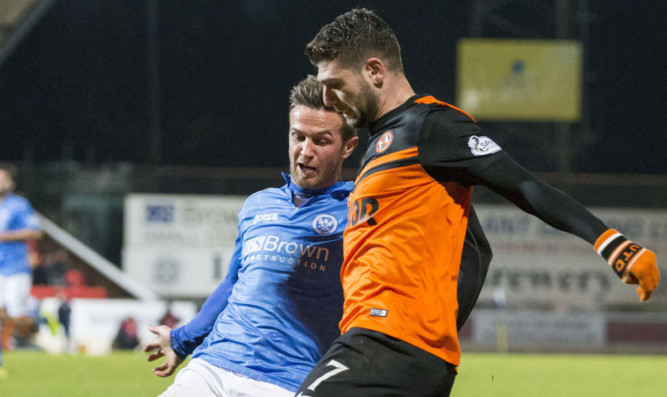 Nadir Ciftci battles for possession with Chris Millar of St Johnstone.