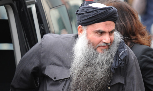 Muslim cleric Abu Qatada arrives back at hihs London address after being given bail by from Long Lartin prison today.   PRESS ASSOCIATION Photo. Picture date: Tuesday November 13 2012. See PA story. Photo credit should read: Stefan Rousseau/PA